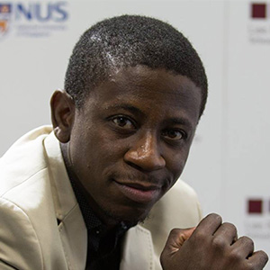 Tony Blair and David Sengeh greet each other at Prince of Wales school in Freetown, Sierra Leone
