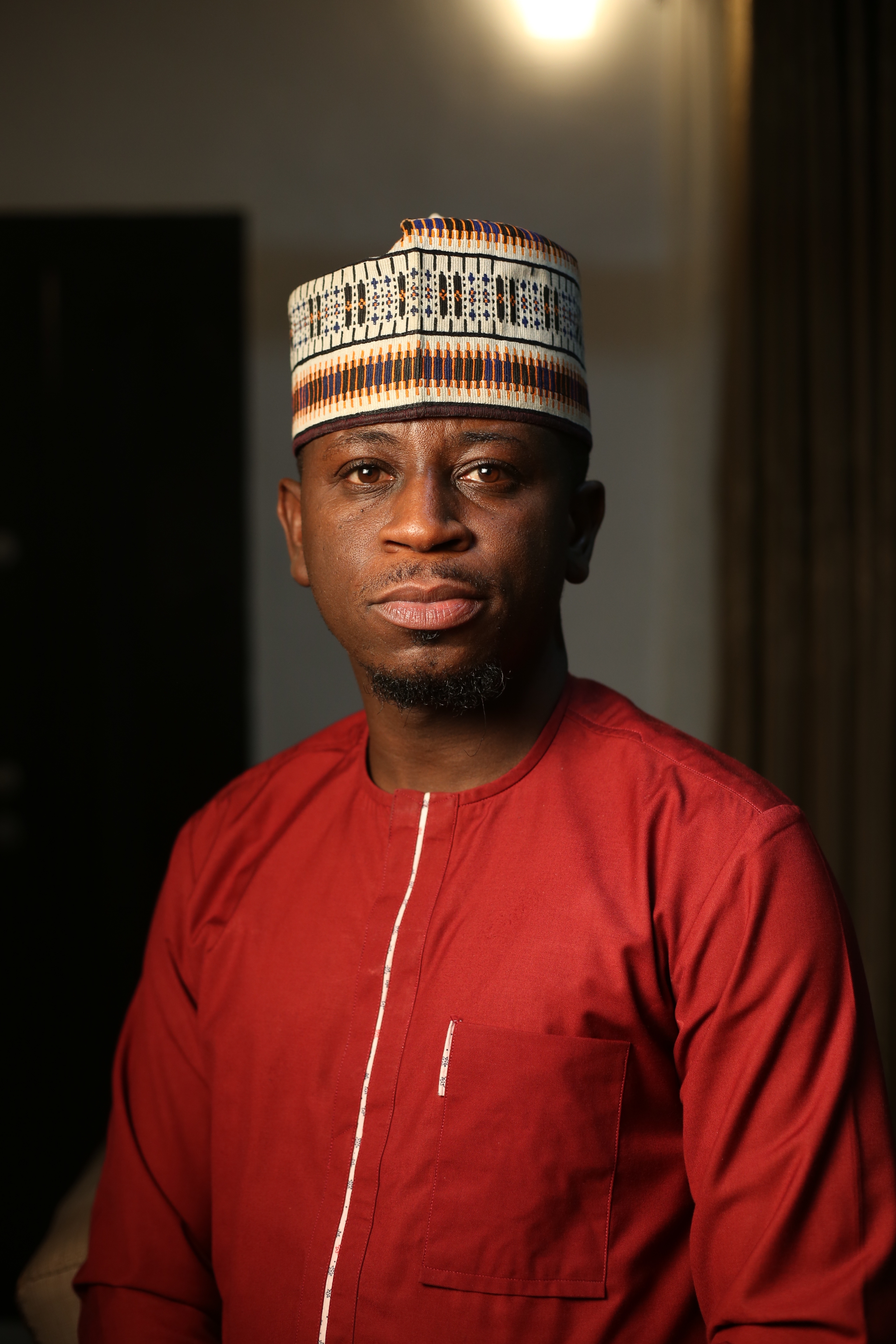 Tony Blair and David Sengeh greet each other at Prince of Wales school in Freetown, Sierra Leone